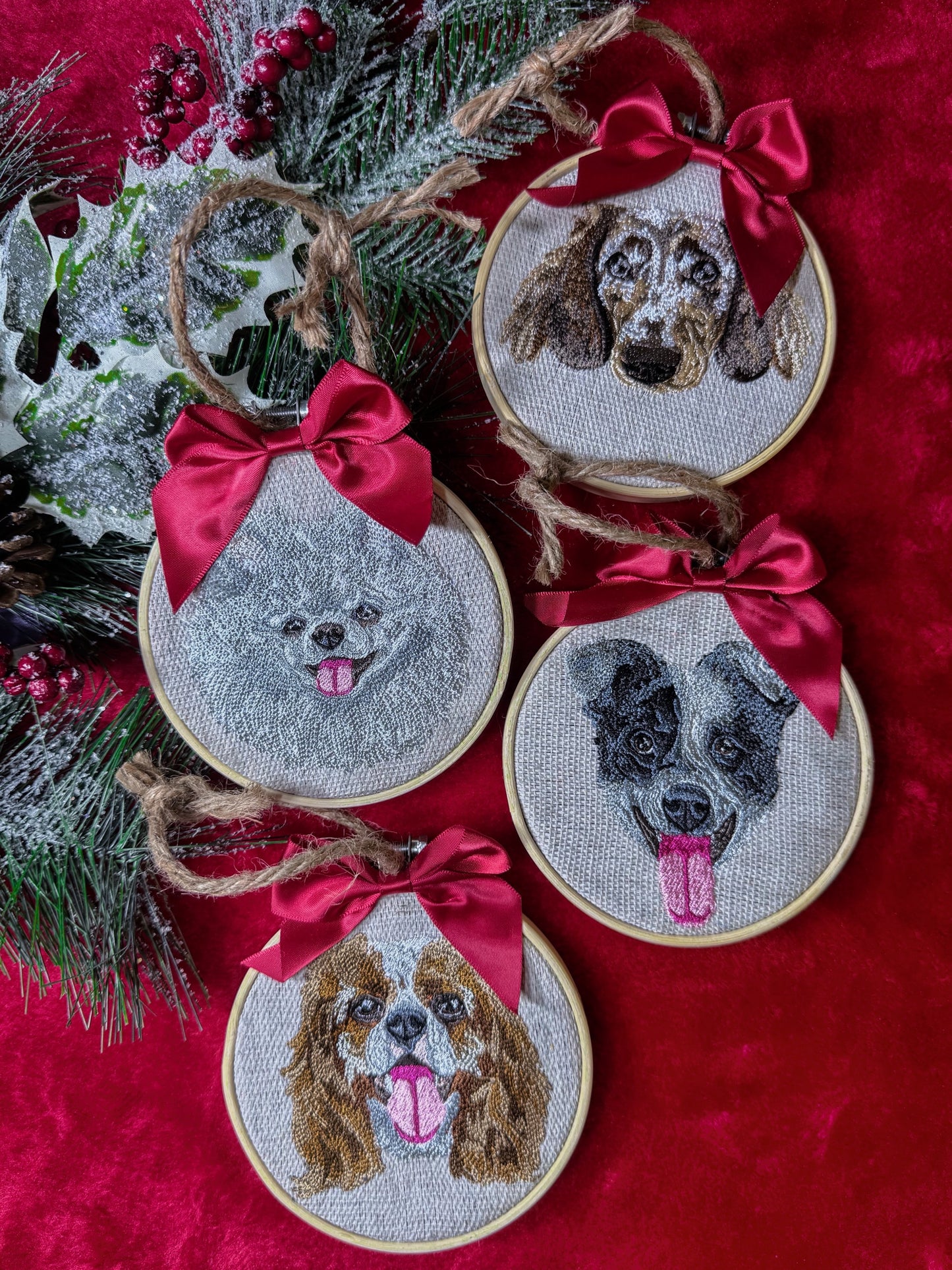 Embroidered dog portraits with red bows on a red background