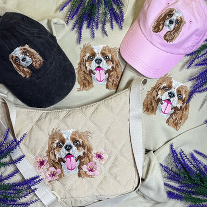 Embroidered dog designs on hats and a bag with lavender flowers.